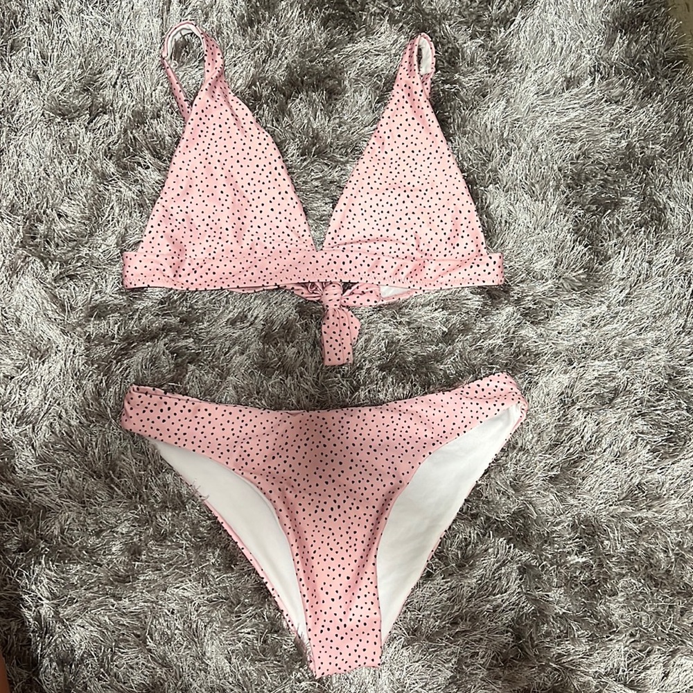 Pink polka dot bikini. Size large fits like a medium. NEVER WORN.